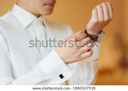 businessman clock clothes, businessman checking time on his wrist watch. mens hand with a watch, watch on a man's hand, putting the clock on the hand, fasten clock watch time, man's style