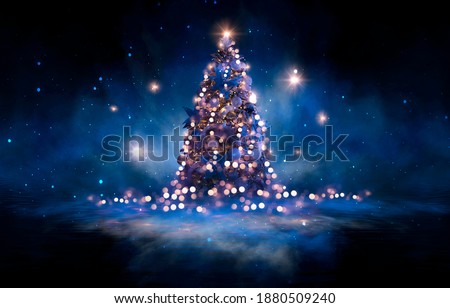 Night winter forest fantasy landscape with a Christmas decorated tree. Festive bokeh lights, dark forest, neon lights. Decorated Christmas tree in the night forest. Background for postcards. 