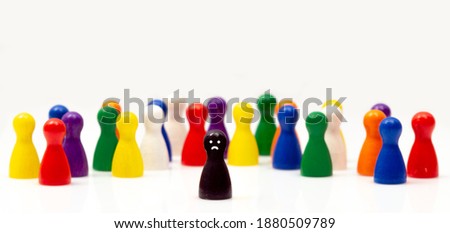 one stands out from others. wooden toys and a lonely pawn figurine. Concept of distinctive personality, social anxiety, social exclusion, bullying, depression, make fun of others, outsider and loner. Royalty-Free Stock Photo #1880509789
