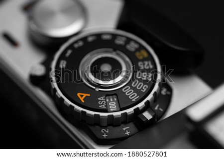 Shutter speed dial with exposure compensation values on a vintage film camera