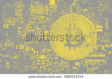 Digital currency bitcoin on computer chip, closeup