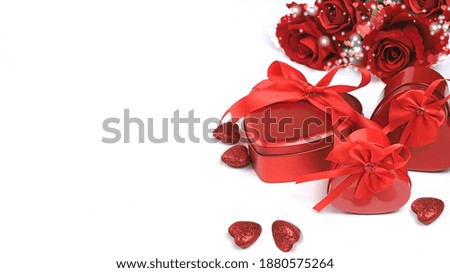 Postcard for Valentine's Day or Women's Day. Background, banner, hearts, flowers and gift boxes. Happy holiday, congratulation, birthday, wedding, selective focus,