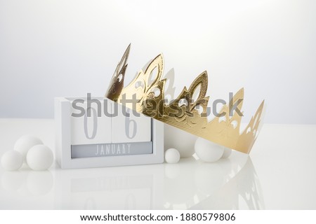 Happy Epiphany day, three kings day. Calendar with king crown on white background Royalty-Free Stock Photo #1880579806
