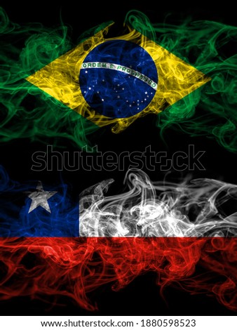 Brazil, Brazilian vs Chile, Chilean smoky mystic flags placed side by side. Thick colored silky abstract smoke flags.