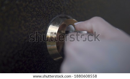 Girl opens door lock key close-up