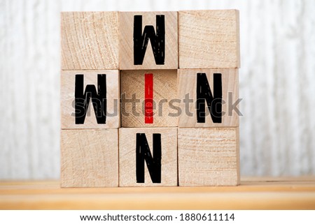 Win win, wooden block with text. Business concept. Selective focus.