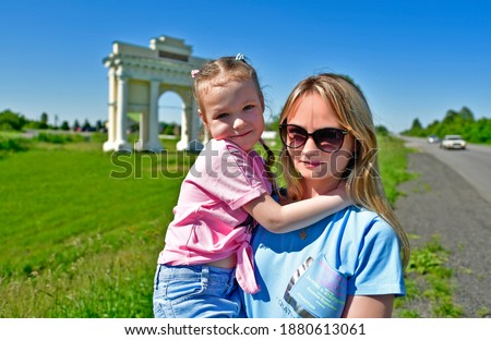 Mom and little daughter travel to the sights of the city of Ukraine Poltava.
