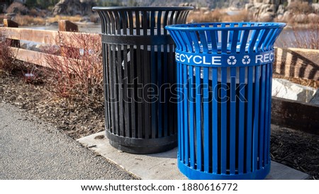 Blue metal recycle bin the park