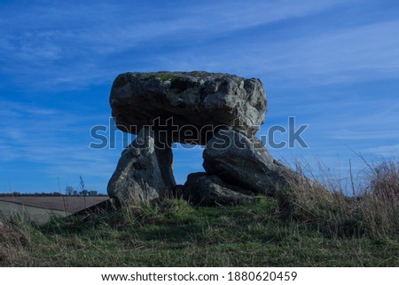 Avebury is a Neolithic henge monument containing three stone circles, around the village of Avebury in Wiltshire, in southwest England. One of the best known prehistoric sites in Britain