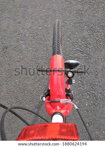 Front wheel of a bicycle on asphalt road