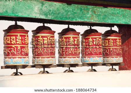 Tibetan prayer wheels in Buddhism temple