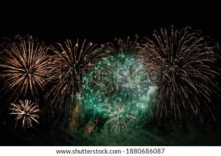 Fireworks illuminates the sky with a dazzling display. Colorful fireworks with bokeh background. Abstract festive background