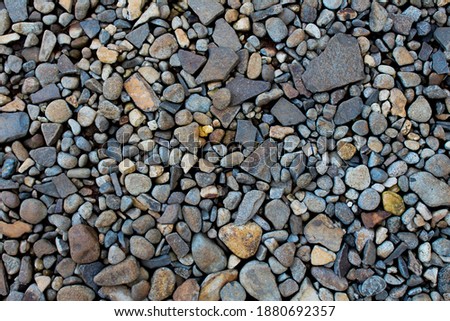 several rocks of various sizes arranged randomly on the home page