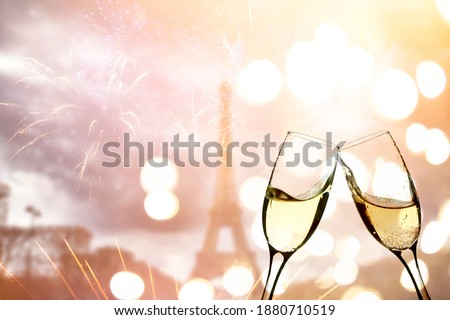 Champagne and Eiffel tower with fireworks, celebration of the New Year in Paris, France
