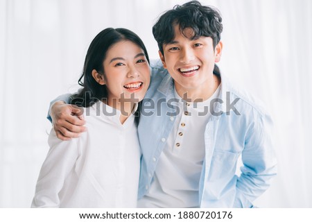 Asian couple happily embracing each other
 Royalty-Free Stock Photo #1880720176