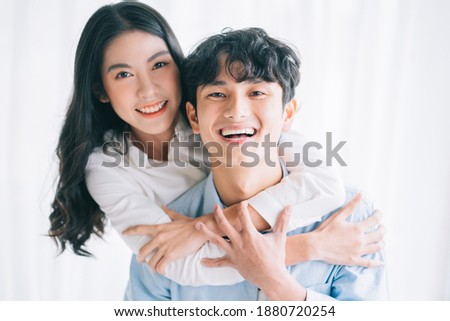 Asian couple happily embracing each other
 Royalty-Free Stock Photo #1880720254