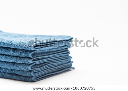 Blue face towel taken on a white background