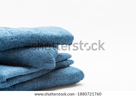 Blue bath towel taken on a white background
