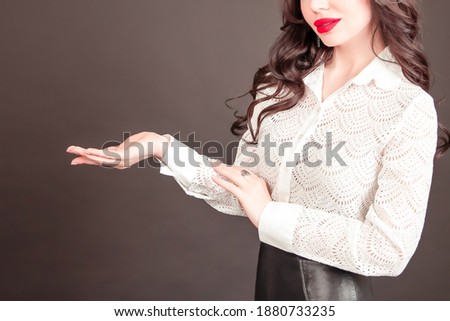 Young happy business woman holding her hand palm up. student. education. Copy space