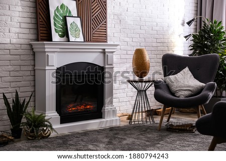 Beautiful living room interior with fireplace and furniture