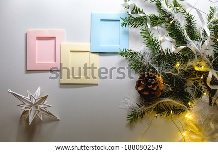 Christmas frame background with xmas tree and xmas decorations. Merry christmas greeting card, banner. Winter holiday theme. Happy New Year. Space for text or your photo. 