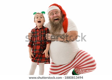 Emotional fat funny and tattooed man with kid girl isolated on a white background