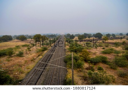 Picture of pastel sunset on railroad track in rural scene