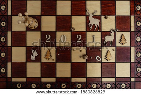 concept photography, new year composition on a chessboard with a queen and other pieces, 2021, Flat lay, copy space