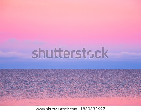 Soft focus. Fantastic Arctic purple evening minimalistic seascape. Natural background of magenta.