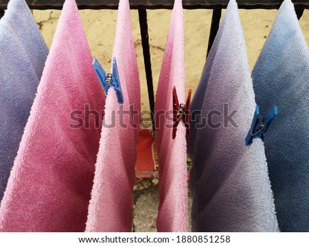 A high angle shot of the hanging wet towels to dry