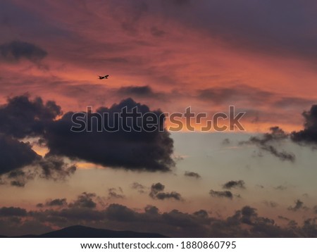 a plane on amazing sunset with clouds 