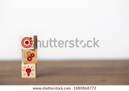 Business strategy and action plan concept. On wooden cube block.
