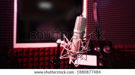 Professional microphone close-up on the background of recording studio