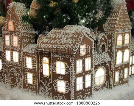 Christmas installation, a city made of gingerbread. New year and Christmas decoration, holiday atmosphere.