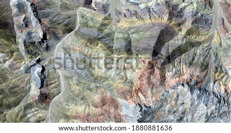 rocks painted by time, United States, abstract photography of relief drawings in  fields in the U.S.A. from the air, Genre: Abstract Naturalism, from the abstract to the figurative, 