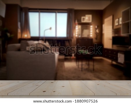 Modern liveing room black golden tone with wooden tabletop space  Royalty-Free Stock Photo #1880907526