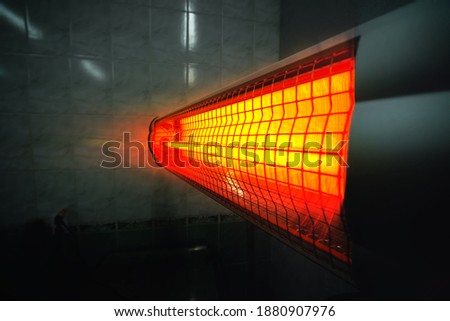 infrared heater. Industrial premises. Close up, selective focus. Copy space Royalty-Free Stock Photo #1880907976