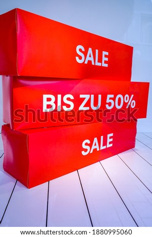 sale sign at a shop - photo - translation: up to 50%