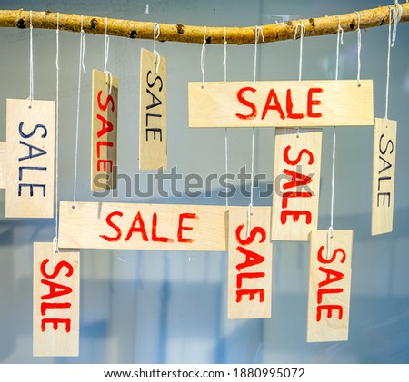 sale sign at a shop - photo
