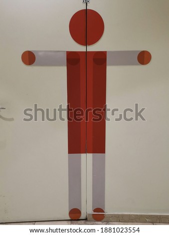 Sign of toilet  for men on wall inside shopping mall