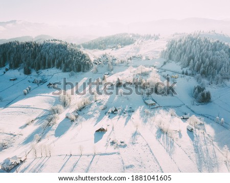 Beautiful winter scenery. Transylvanian village covered in snow. Location: Brasov, Romania.