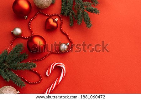 Christmas decorations with red balls and red background