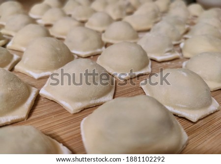 Traditional russian dumplings in macro style. Frozen dumplings or ravioli.