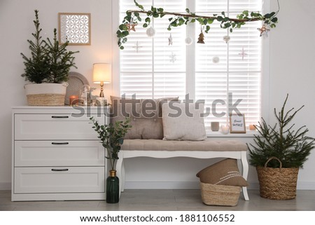 Beautiful room interior decorated for Christmas with potted firs