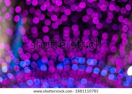 Christmas and New Year festive glitter bokeh background with purple, pink and blue colors. Festive holidays greeting cards. Wedding party decoration. Abstract. Fairy lights decor. Copy space.