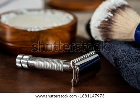 Old style men’s shaving accessories, safety and straight razors, brush and shaving soap, for home use. Royalty-Free Stock Photo #1881147973