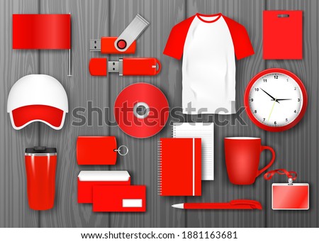 Red corporate identity promotional set. Business corporate souvenir promotion stationery items. Flag, letter, cover, brochure, mug, business card, bag, badge, cap, wall clock, pen, notebook vector Royalty-Free Stock Photo #1881163681