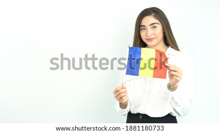 blonde woman waving romania flag in front of white background