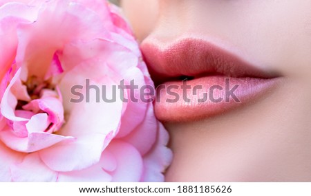 Tenderness and forgiveness. Tenderness womans lips with pink rose. Tenderness woman. Concept of caring and tenderness