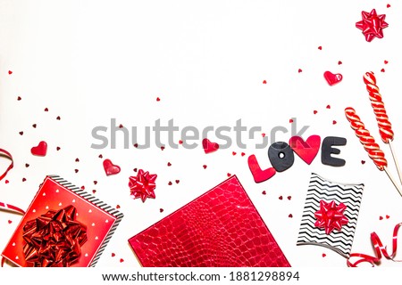Valentine's day romantic party concept. Gift boxes, heart shape, sweets, black and red decorations on white background. Top view, flat lay, copy space